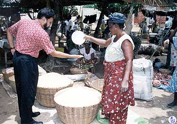 Dr Amit Roy visiting a market in Togo
