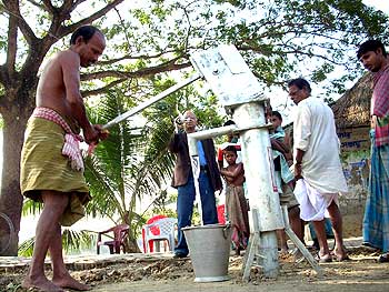 Kabir Suman supervises the sinking of a tubewell in a village