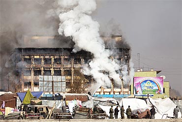 Smoke rises from a shopping mall after a Taliban attack in Kabul