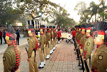 Security personnel prepare to give the gun salute to Jyoti Basu