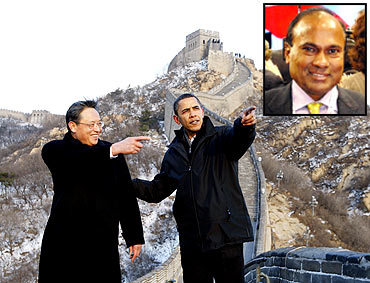 Obama at the Great Wall of China with Chinese diplomat Zhou Wenzhong and (inset) Narender Reddy
