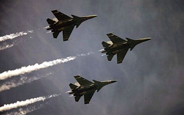 Three planes in formation fly over Rajpath