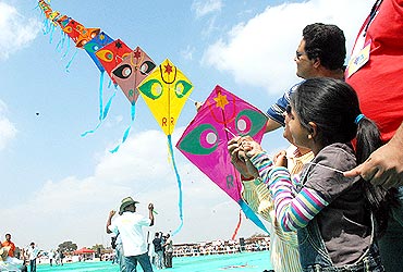 Kites attract children during International Kite festival at the Bangalore Palace grounds