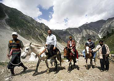 Pilgrims ride ponies to the Amarnath shrine