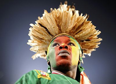 A fan awaits the start of a 2010 World Cup Group E soccer match between Cameroon and Denmark at Loftus Versfeld stadium in Pretoria on June 19, 2010.