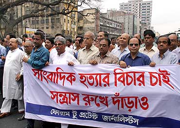 An organisation of editors and journalists stages a silent march in Dhaka