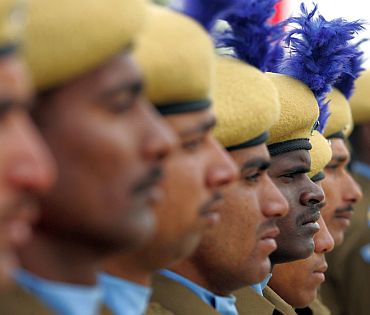 CRPF recruits stand at attention during their passing out parade in a camp in Humhama on the outskirts of Srinagar