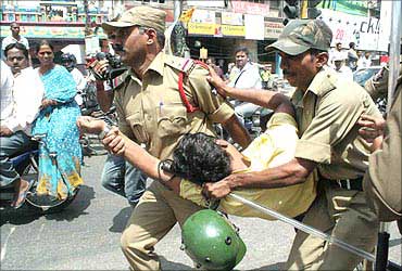 Police try to foil a demonstration during the bandh