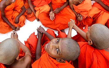 Monks attend a special prayer to mark Buddha Jayanti in Bhopal
