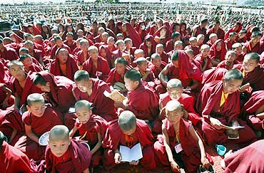 Buddhist monks listen to the Dalai Lama in Tawang
