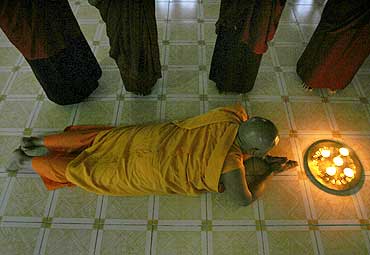 A Tibetan monk prays at a monastery in Siliguri