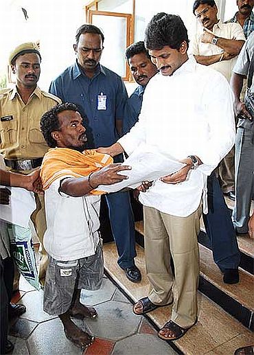 File photo shows Jagan meeting a supporter outside his residence