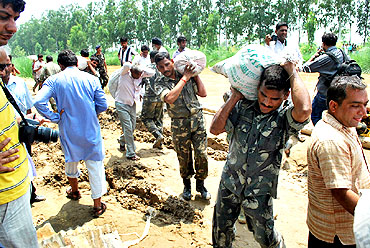 Army personnel help in rescue efforts
