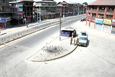 Srinagar bore a deserted look as curfew was clamped in some areas on Tuesday