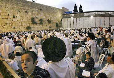 Jewish worshippers pray at the Western Wall in Jerusalem