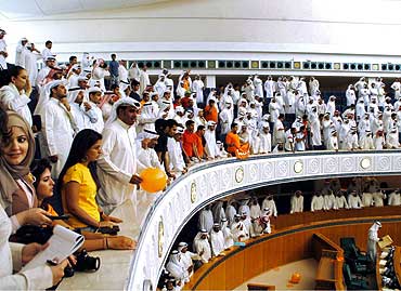 Kuwaitis attend a Parliament session on electoral law