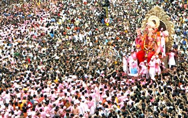 Devotees carry a statue of Lord Ganesh during immersion in Mumbai