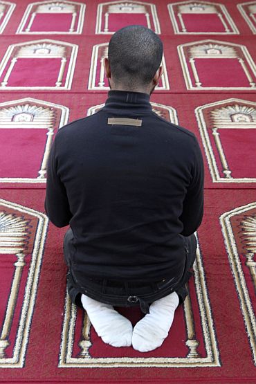 A Muslim man prays in the Er-Rahma mosque in Nantes, western France