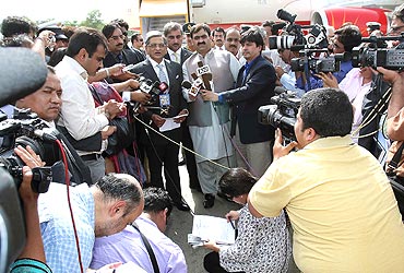 Krishna addresses the media at the Chaklala airport in Islamabad