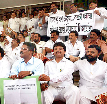 Maharashtra Opposition legislators protest outside the Maharashtra assembly