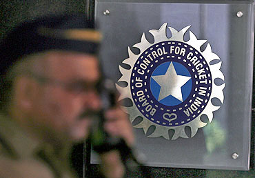A policeman walks past the Board of Control for Cricket in India headquarters in Mumbai