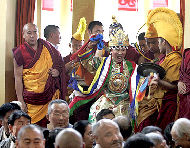 A member of the Nechung Oracle arrives for prayers for the Dalai Lama in Dharamsala last year
