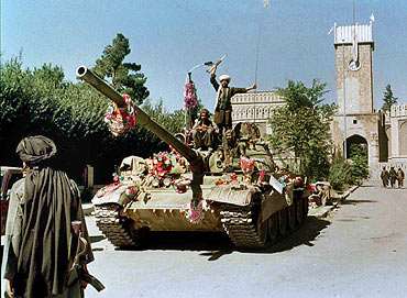 A file photograph shows Taliban members celebrating the seizure of Kabul