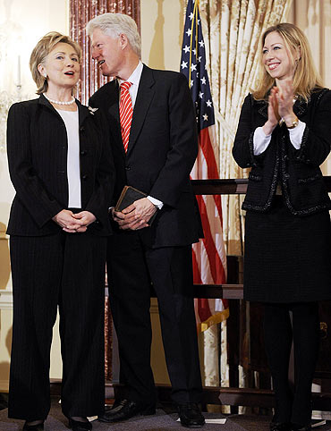 US Secretary of State Hillary Clinton with her husband Bill and daughter Chelsea
