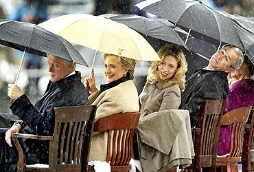 Former US President George W Bush with the Clinton family