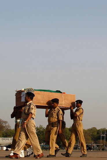 CRPF men bear a coffin of a trooper slain in the Dantewada massacre