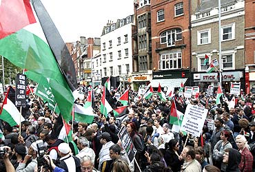 Pro-Palestinian demonstrators protest outside the Israeli embassy in London