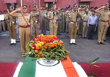 CRPF personnel pay homage to a colleague killed in a Maoist attack in Chhattisgarh on April 6, 2010.