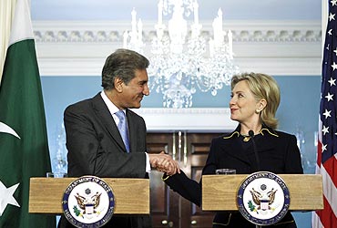 US Secretary of State Hillary Clinton shakes hands with Pakistani Foreign Minister Shah Mehmood Qureshi at a meeting in Washington