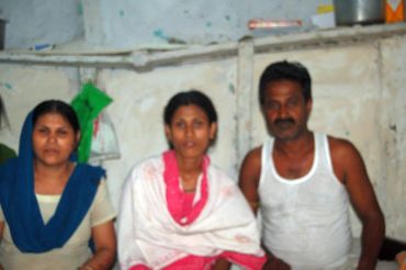 Mohammed Habeeb (right) with his wife and daughter at their tenement in JP Nagar, Bhopal