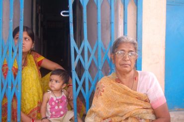 Kusumbai (right) sits outside her house in Bhopal