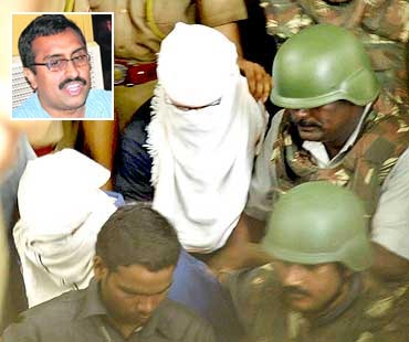 Devender Gupta and Lokesh Sharma, hooded, being produced in a Hyderabad court. Inset: Ram Madhav