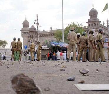 Policemen stand guard at the Mecca Masjid, Hyderabad, May 18, 2007
