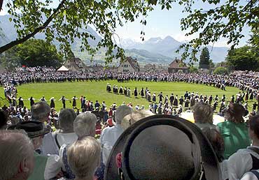 Participants dance at a traditional costume festival in Schwyz