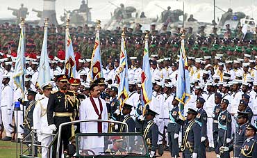 Sri Lanka's President Mahinda Rajapaksa inspects a parade in Colombo
