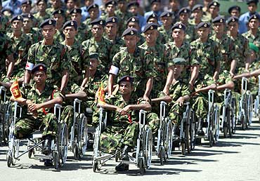 Disabled army soldiers take part in the parade in Colombo