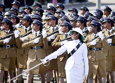 Women police officers march at a war victory ceremony in Colombo