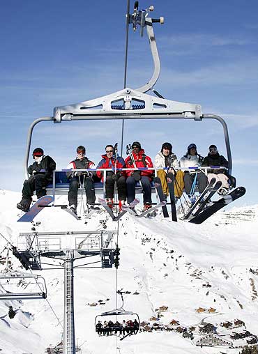 Skiers on a chairlift at Les Crosets, 120 kilometres east of Geneva, Switzerland