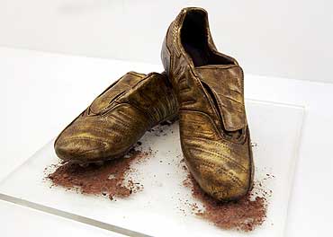 A pair of chocolate soccer boots