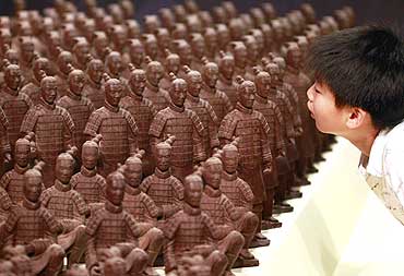 A boy looks at chocolate terracotta warriors