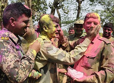 Border Security Force soldiers celebrate Holi