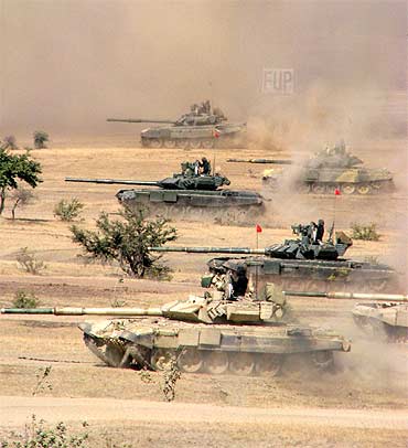 Indian battle tanks in action during an exercise