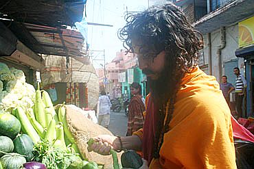 An ascetic shops for vegetables in a market at Kankhal, Haridwar