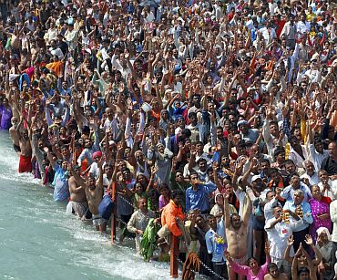 Devotees offer prayers after taking a holy dip in the Ganga