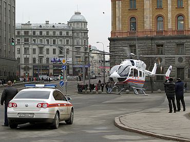 A helicopter of the Russian Emergencies Ministry prepares to ascend near the Lubyanka metro station in Moscow