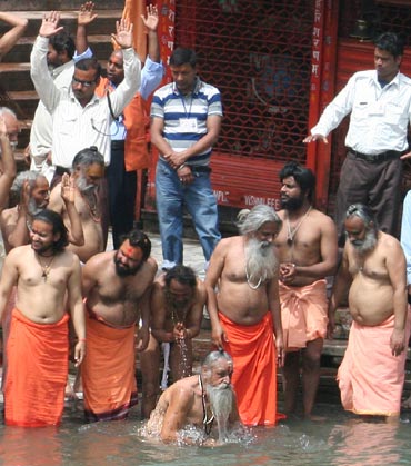 Sadhus take a dip in the Ganges